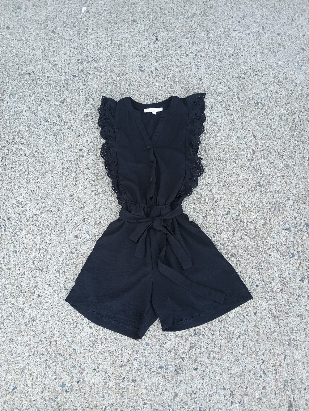 Monteau Black Romper With Tie. Sleeveless With An Eyelet Ruffle Detail Size L
